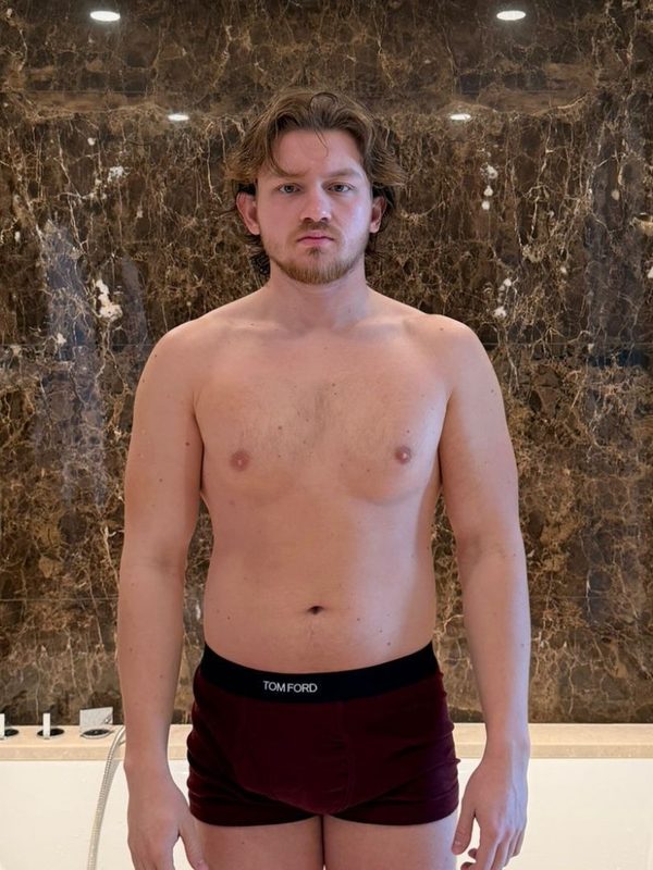 Berke before coaching, standing in a bathroom.