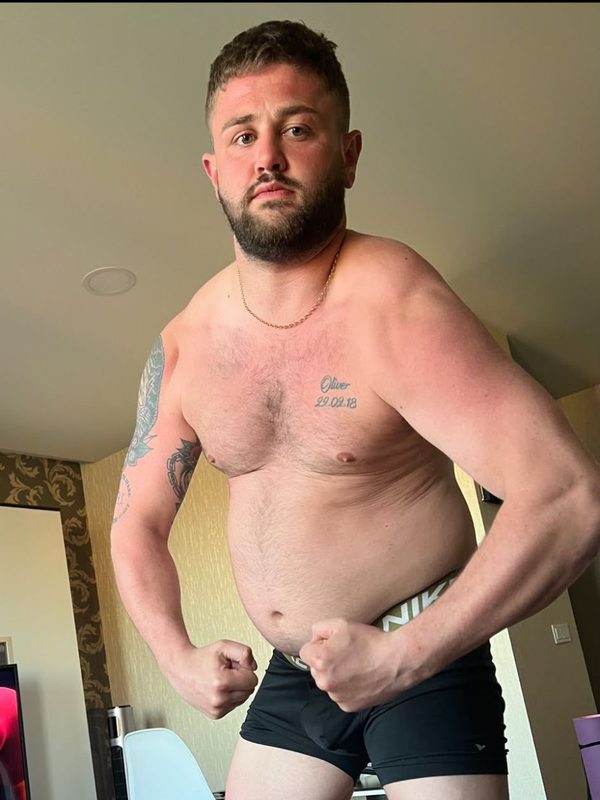 James before coaching, flexing in his living room.